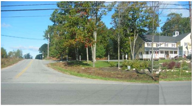 Photograph of a business accessed by a side road rather than a frontage on a busy street.